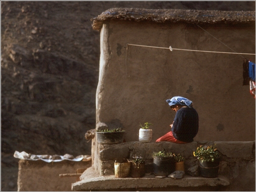 A young girl day dreams in a High Atlas village, Morocco.