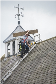 Steeple Jacks on the roof with plank